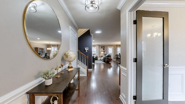 entrance foyer featuring wood-type flooring and ornamental molding