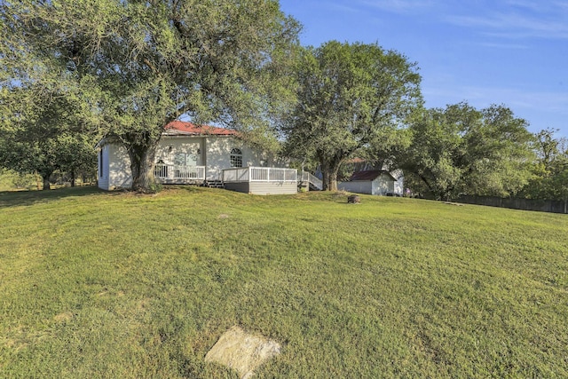 view of yard with a deck