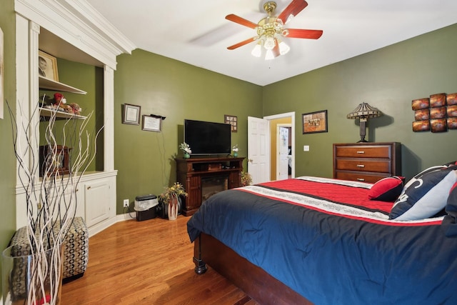 bedroom featuring hardwood / wood-style floors and ceiling fan