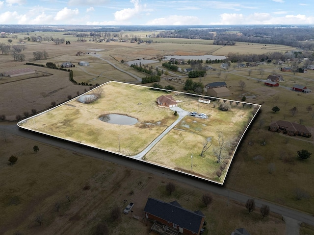 birds eye view of property featuring a rural view