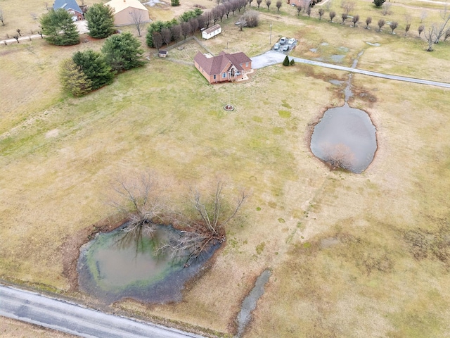 aerial view with a water view and a rural view