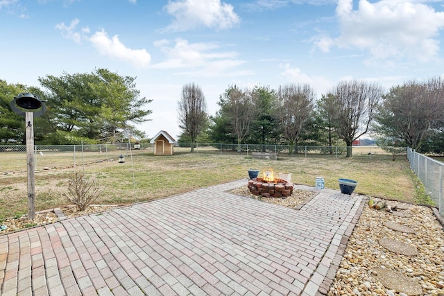 view of patio / terrace with an outdoor fire pit