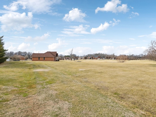 view of yard with a rural view