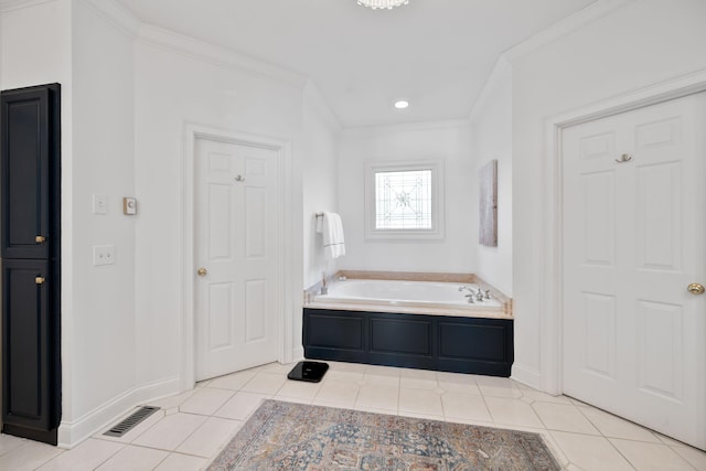 bathroom featuring tile patterned floors, a tub to relax in, and ornamental molding