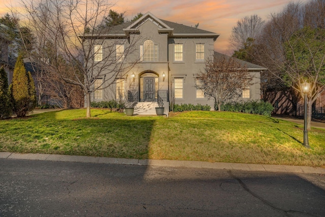 view of property featuring a yard