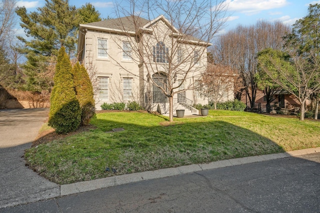 front facade with a front yard