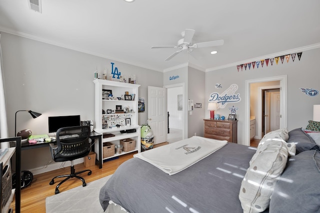 bedroom with crown molding, ceiling fan, ensuite bathroom, and light wood-type flooring