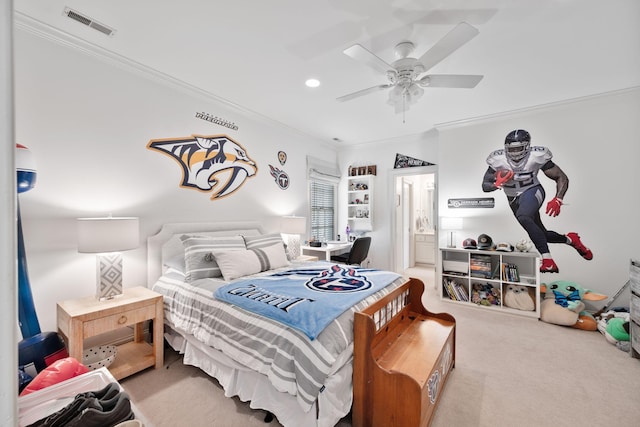 bedroom featuring light carpet, ornamental molding, ceiling fan, and ensuite bathroom