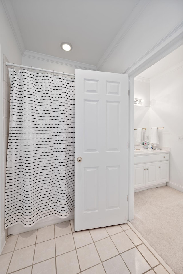 unfurnished bedroom with ornamental molding, light colored carpet, and ensuite bathroom