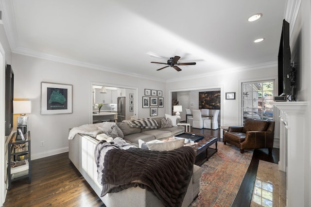 living room with crown molding, ceiling fan, and dark hardwood / wood-style flooring