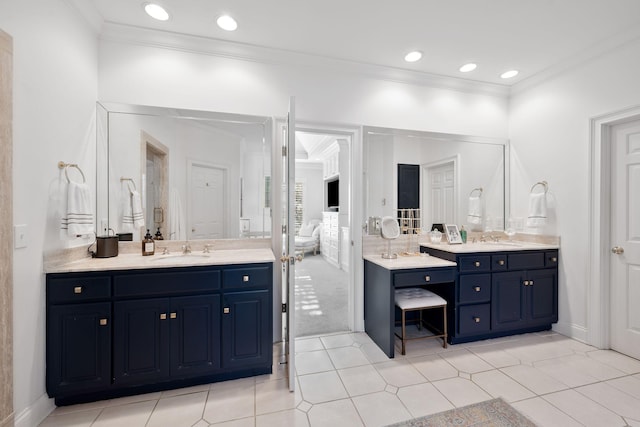 bathroom featuring vanity, tile patterned flooring, and crown molding