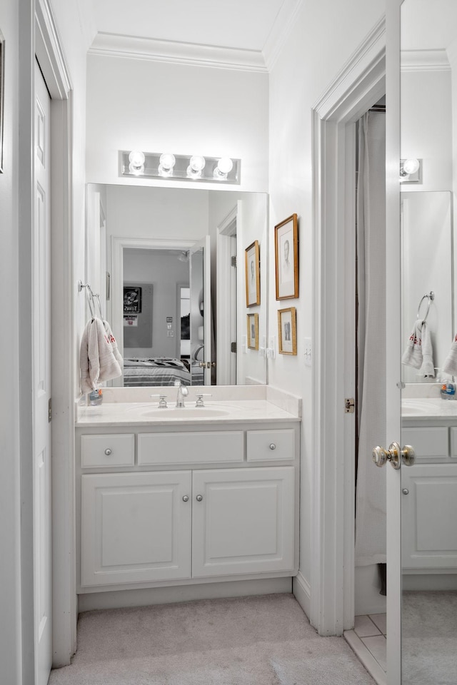 bathroom featuring vanity and ornamental molding