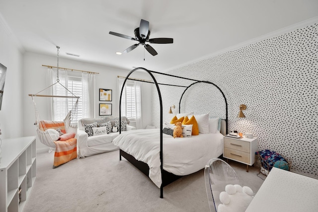 bedroom with crown molding, light colored carpet, and ceiling fan