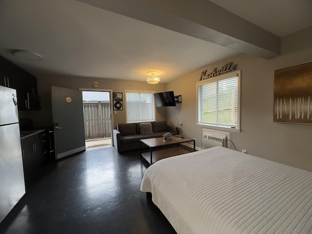 bedroom featuring fridge and a wall mounted AC