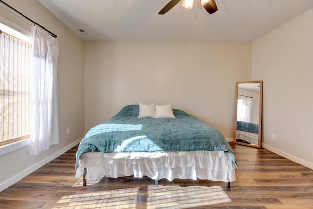 bedroom featuring hardwood / wood-style flooring and ceiling fan