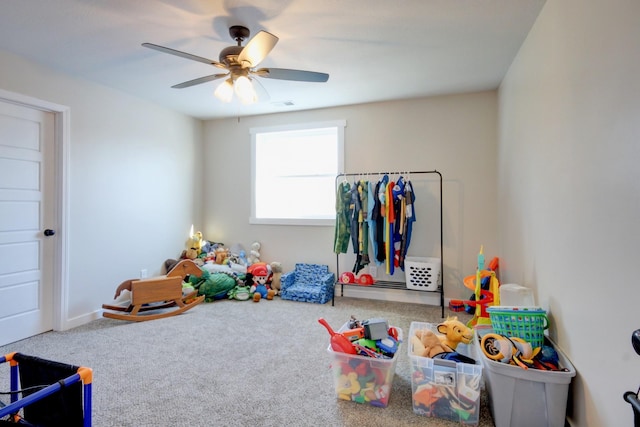 recreation room featuring ceiling fan and carpet flooring