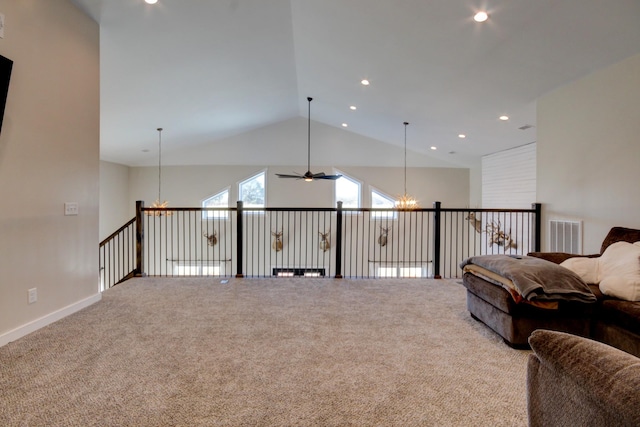 sitting room featuring an inviting chandelier, carpet floors, and high vaulted ceiling