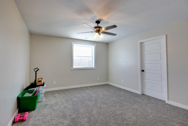 spare room with light carpet and ceiling fan