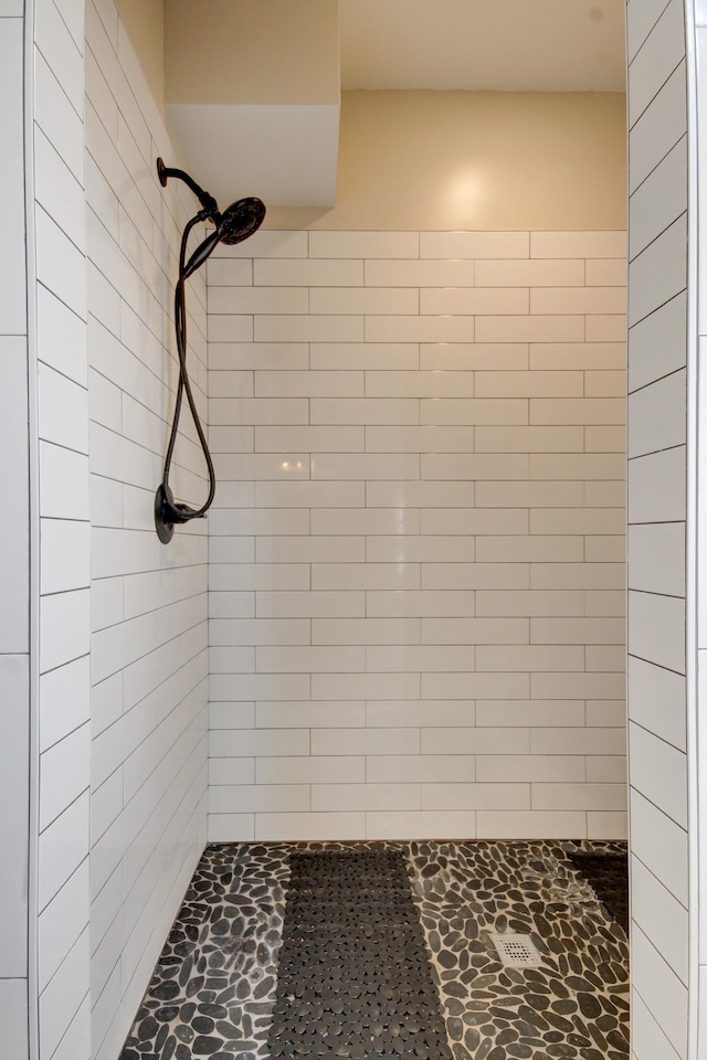 bathroom with tiled shower