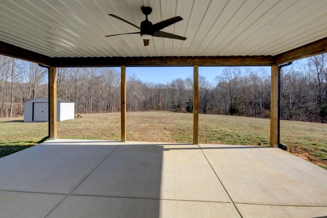 view of patio featuring a shed and ceiling fan