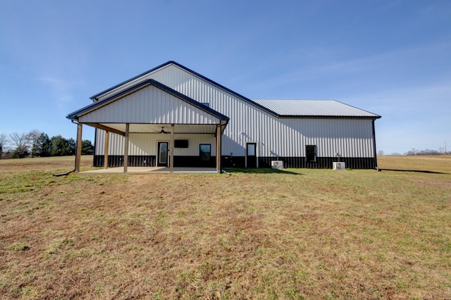 view of outbuilding with a lawn