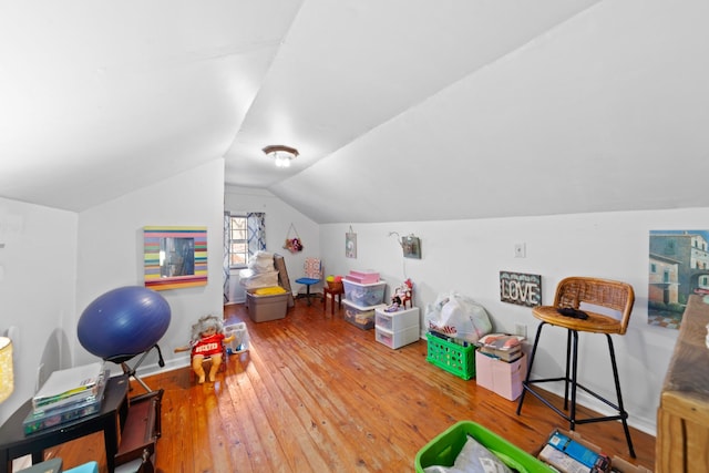 rec room featuring hardwood / wood-style flooring and vaulted ceiling