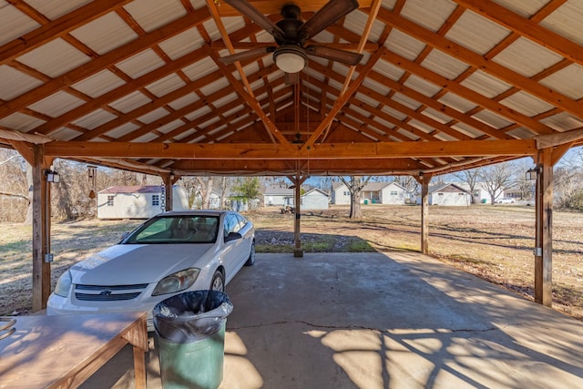 view of patio featuring an outbuilding and ceiling fan