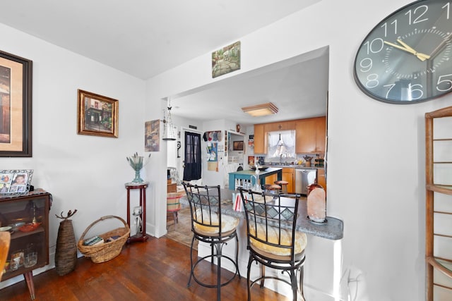 dining space featuring dark hardwood / wood-style floors