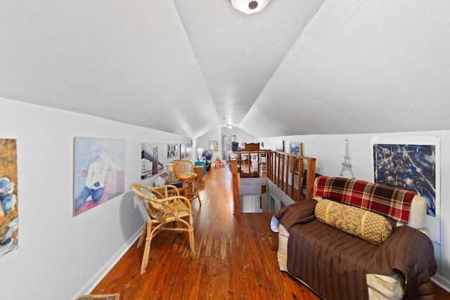 interior space featuring lofted ceiling and hardwood / wood-style floors