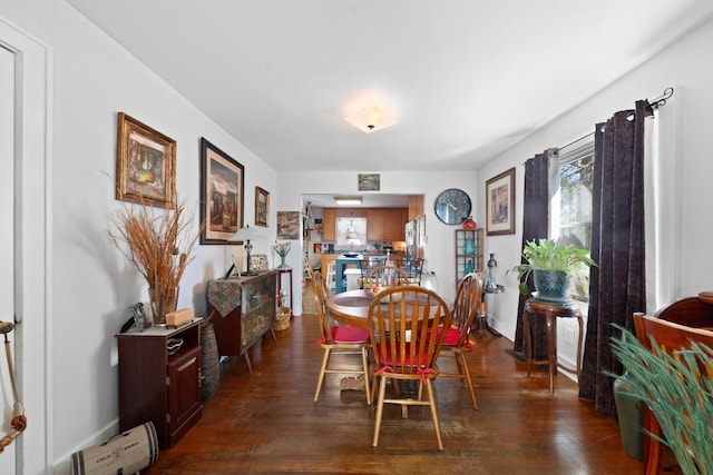 dining space featuring dark hardwood / wood-style flooring