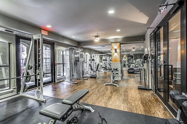 gym with hardwood / wood-style flooring