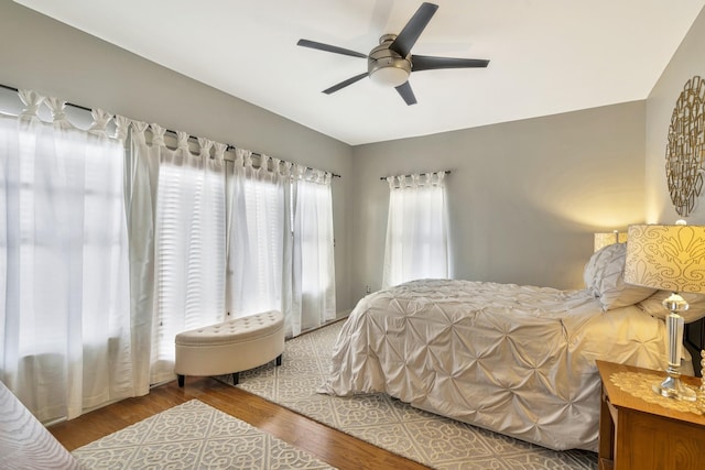 bedroom with hardwood / wood-style flooring and ceiling fan