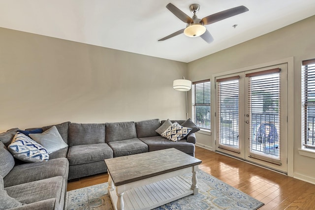 living room with hardwood / wood-style flooring and ceiling fan