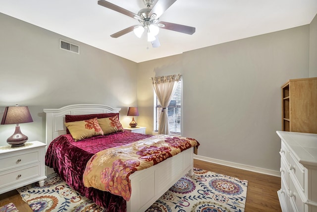 bedroom with dark wood-type flooring and ceiling fan