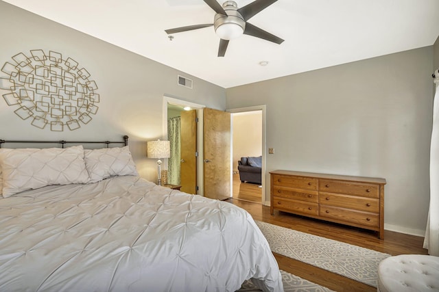 bedroom featuring wood-type flooring and ceiling fan