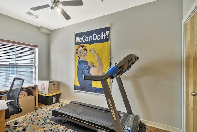 workout area with ceiling fan