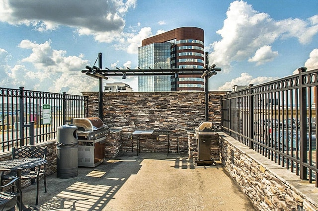 view of patio featuring area for grilling and exterior kitchen