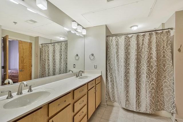 bathroom with vanity and tile patterned floors