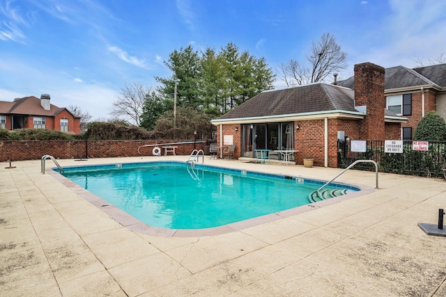 view of swimming pool featuring a patio