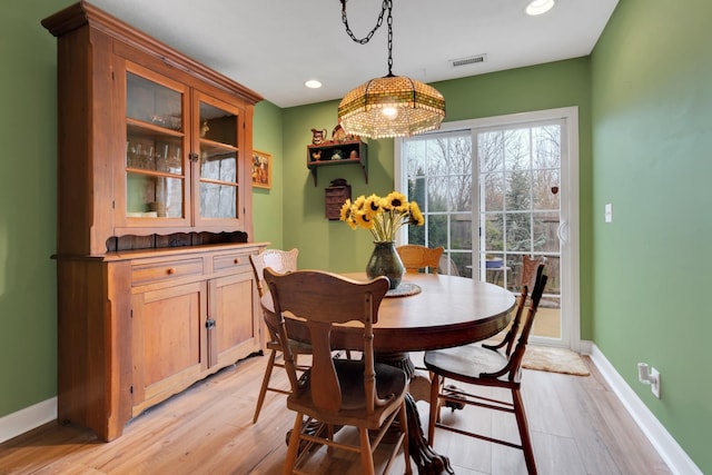 dining room with light wood-type flooring