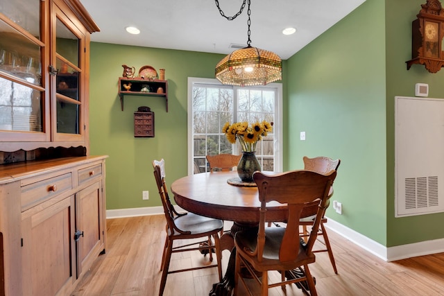 dining area with light hardwood / wood-style floors