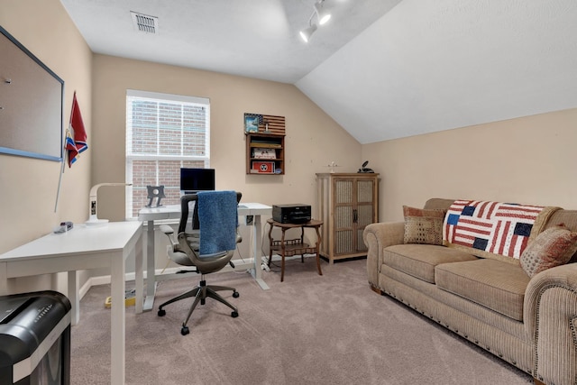 carpeted office with vaulted ceiling