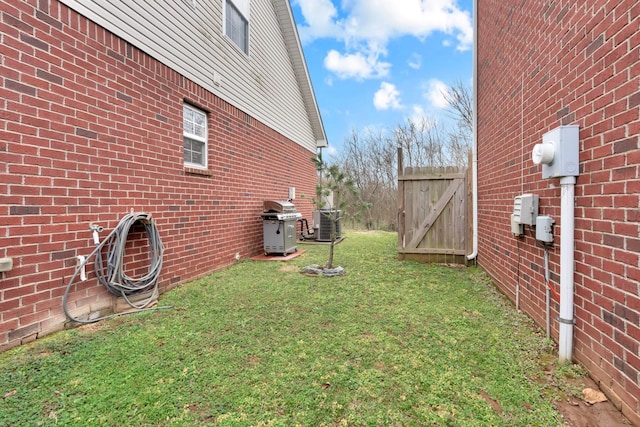 view of yard with central AC unit