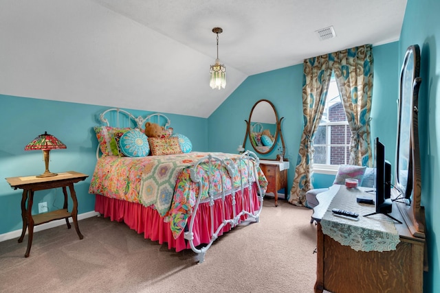 bedroom with vaulted ceiling and carpet flooring