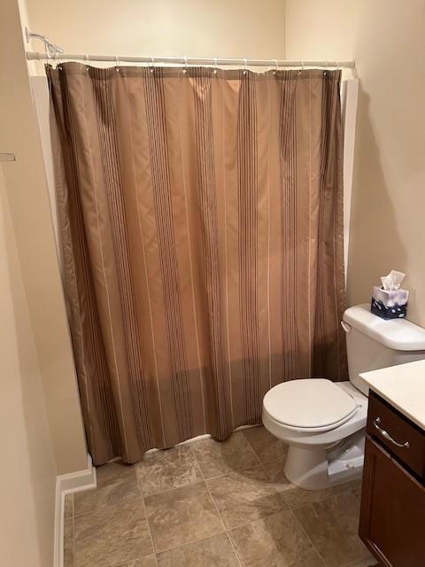 bathroom featuring vanity and toilet