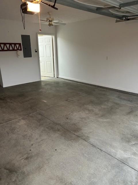 garage featuring a garage door opener and electric panel