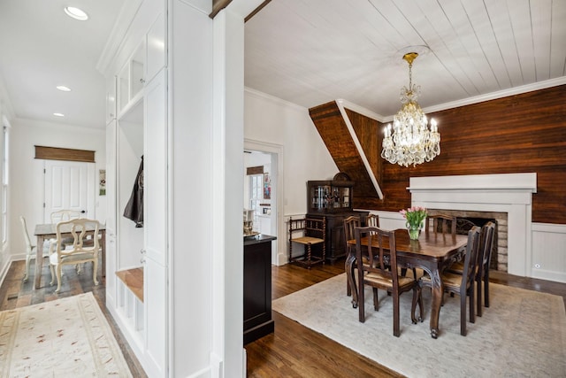 2111 Hoovers Rd, Duck River, TN 38454 - dining space with an inviting chandelier, wood ceiling, ornamental molding, and dark hardwood / wood-style floors