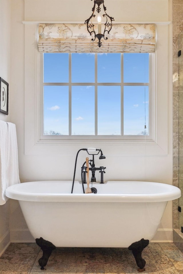 2111 Hoovers Rd, Duck River, TN 38454 - bathroom featuring a healthy amount of sunlight and a washtub