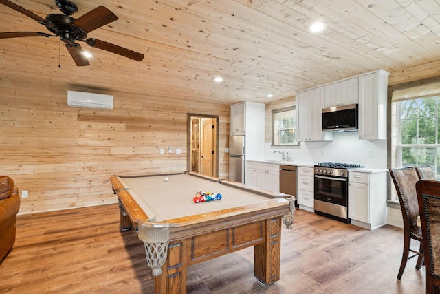 2111 Hoovers Rd, Duck River, TN 38454 - recreation room featuring wood walls, wood ceiling, an AC wall unit, and light wood-type flooring