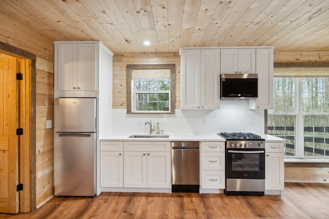 2111 Hoovers Rd, Duck River, TN 38454 - kitchen with white cabinetry, sink, and appliances with stainless steel finishes